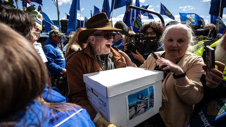More than 300 supporters turned up to watch the group deliver the signatures. Pic: AP