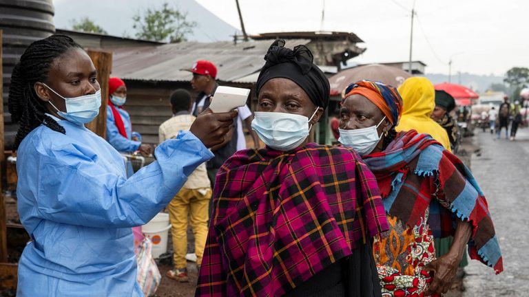 A health worker takes temperatures at a checkpoint before people enter the city of Goma, North Kivu province. Pic: Reuters