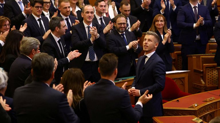 Magyar receiving a standing ovation in parliament. Pic: REUTERS/Bernadett Sz