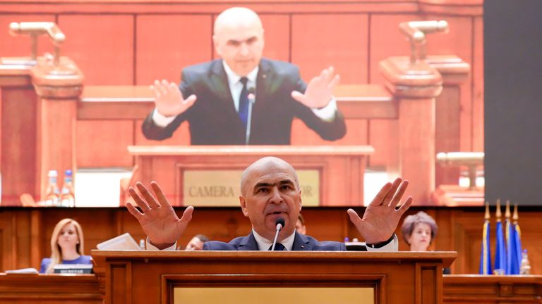 Mr Bolojan addresses a parliament session ahead of a no-confidence vote. Pic: AP