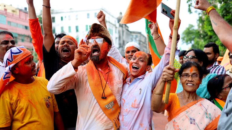 Mr Modi's supporters took to the streets to celebrate. Pics: Reuters