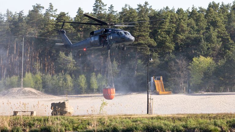 Helicopters have been deployed to drop water on the fires. Pic: Agencja Wyborcza.pl/Reuters