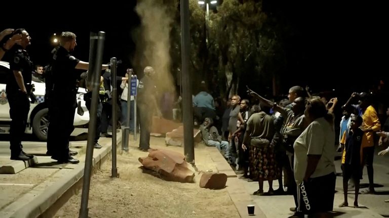 Community unrest outside Alice Springs Hospital, where a man arrested in connection with the alleged killing of the five-year-old was being treated. Pic: ABC via Reuters