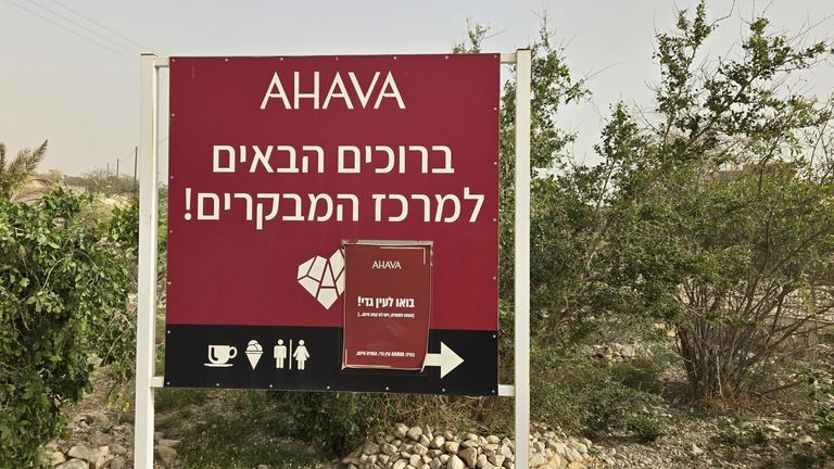 A sign welcomes you to a visitor centre. An attached notice tells readers to go to Ein Gedi which is open late and has free coffee Pic: AFSC