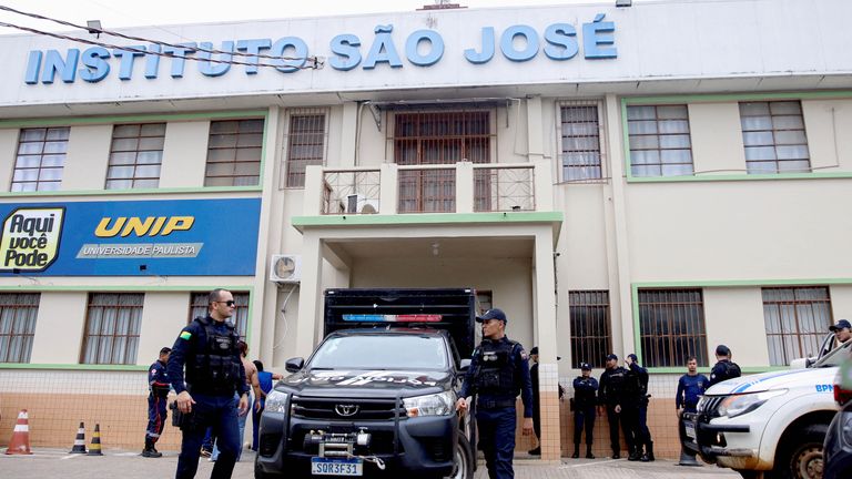Police on patrol outside the school entrance. Pic: Reuters