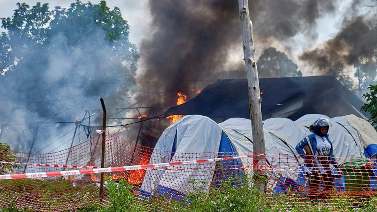 A burning Ebola treatment centre in Rwampara outside Bunia, Ituri province. Pic: Reuters