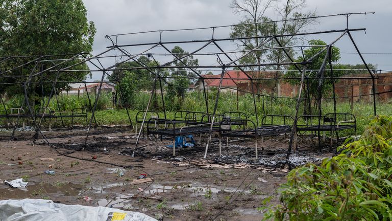 The smouldering ruins of an Ebola treatment centre, destroyed by family members in Rwampara. Pic: AP