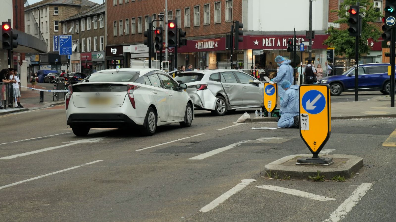 Man arrested after car collides with multiple pedestrians in west ...