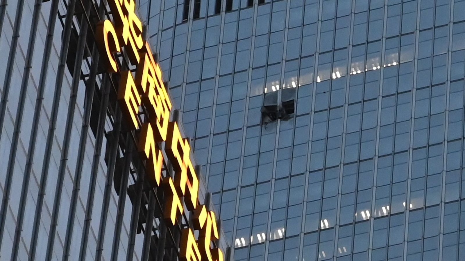 Thirteen injured and pilot killed as plane hits Beijing's tallest building