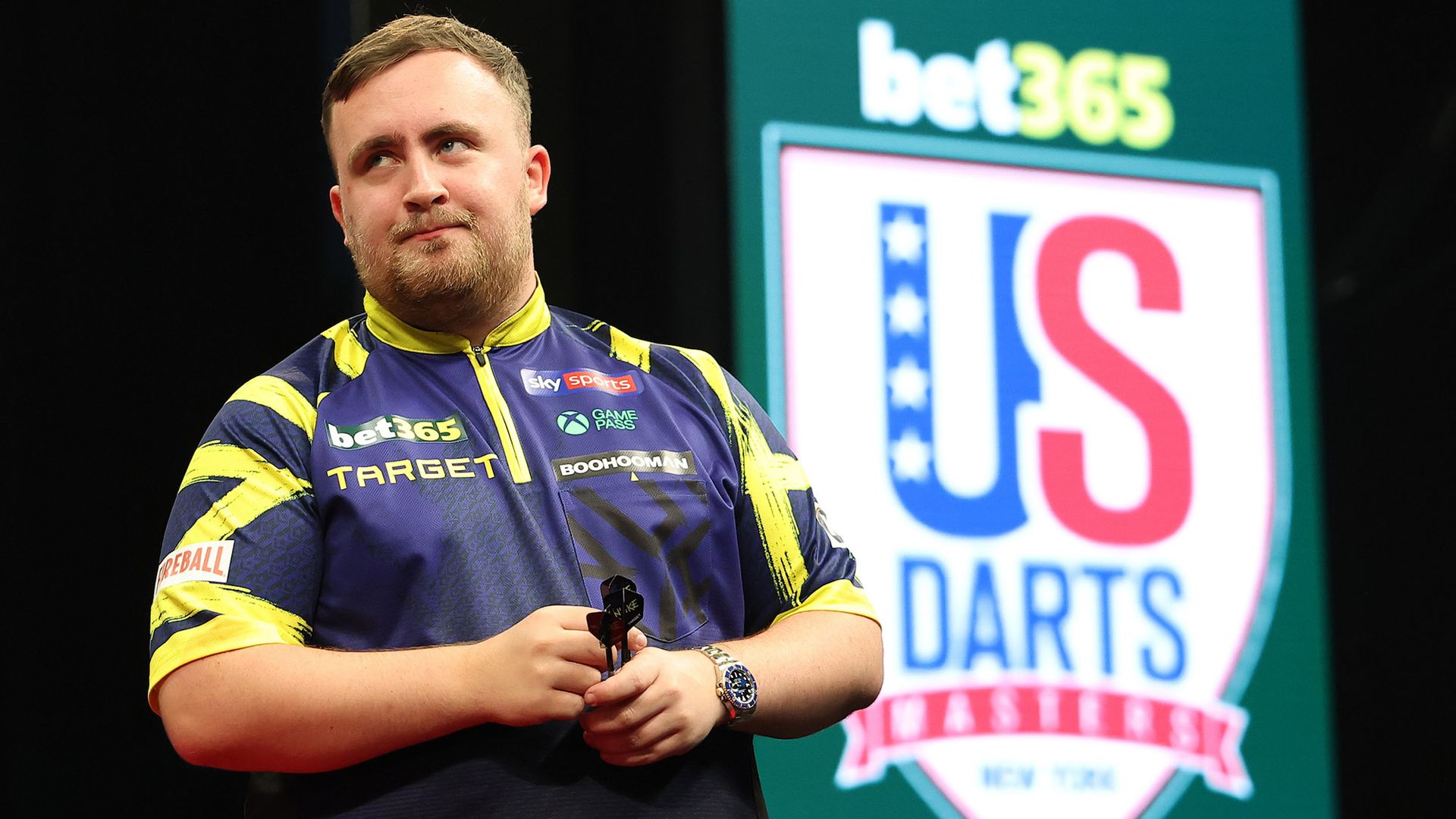 Littler safely through at US Darts Masters as Rock crashes out