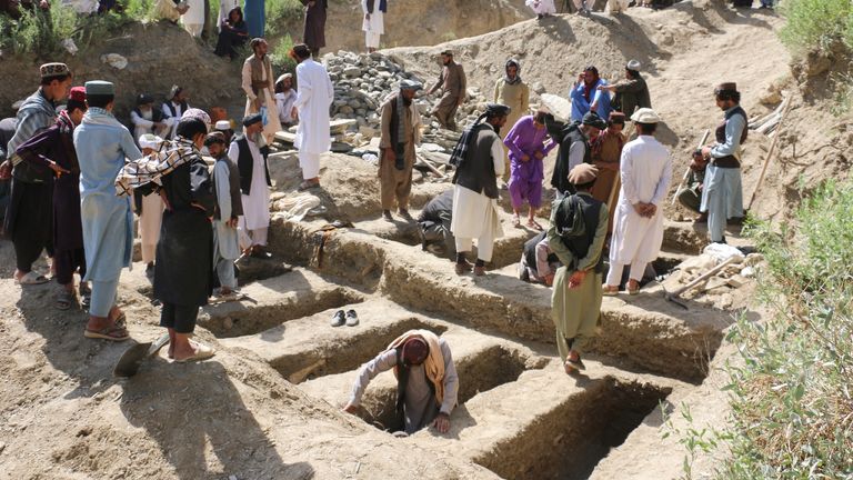 Graves being dug in Mani village. Pic: Reuters