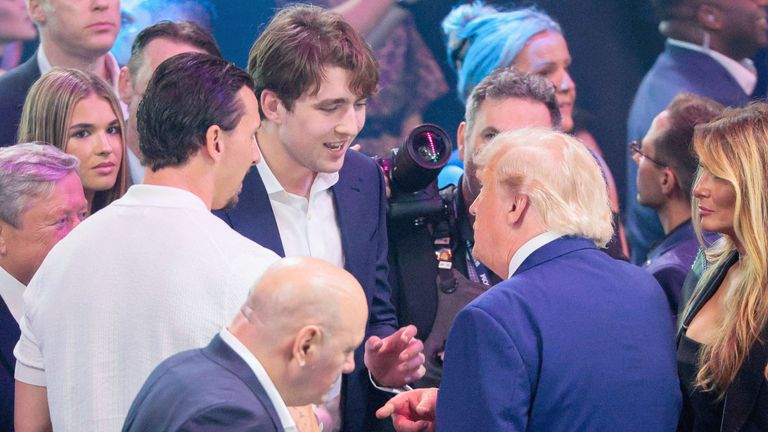 Mr Trump talks to his son Barron Trump and former soccer player Zlatan Ibrahimovic. Pic: Reuters