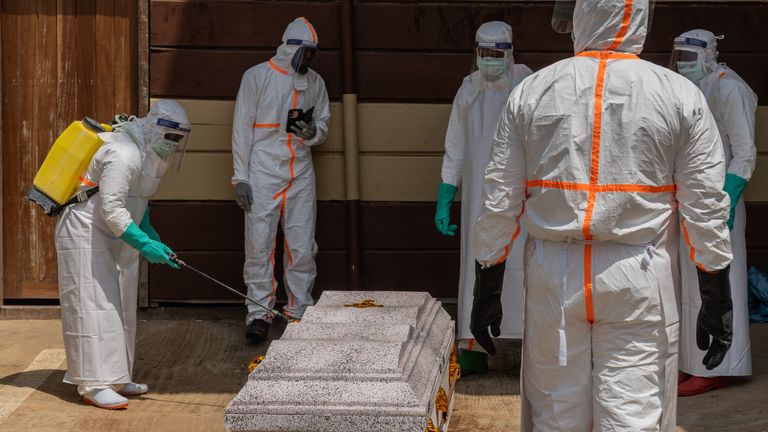 Health workers prepare the coffin of a student who died from Ebola in Bunia. Pic: AP