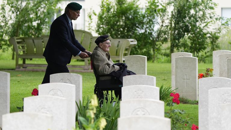 D-Day veteran Ken Benbow views graves at Bayeux Cemetary following the remembrance ceremony. Pic: PA