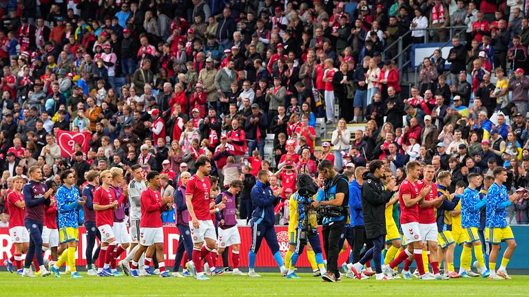 Players leaving the pitch after the match was abandoned. Pic: Reuters 