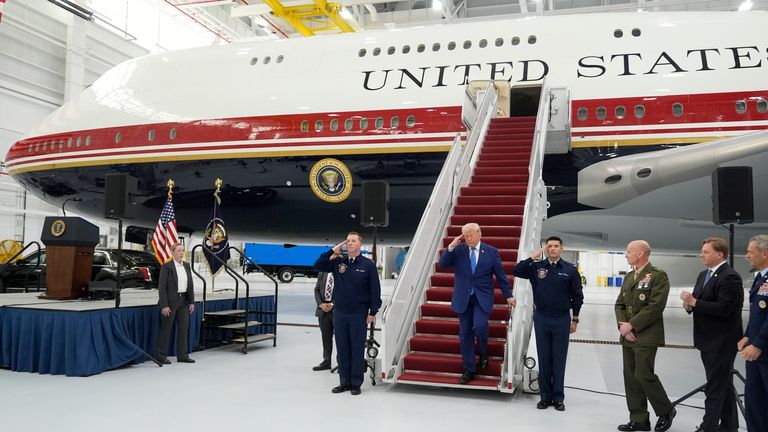 President Donald Trump exits the newly designated Air Force One. Pic: AP