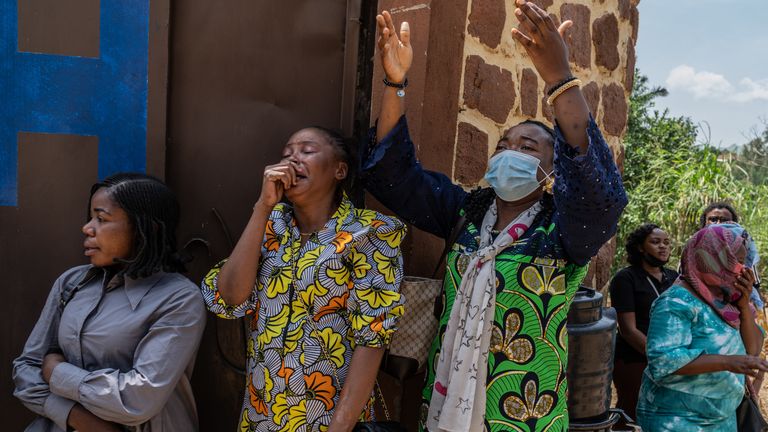 The classmates of a student who died from Ebola mourn. Pic: AP