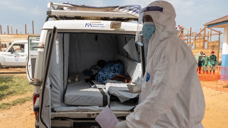 A paramedic with a suspected Ebola patient in Bunia, DRC. Pic: AP