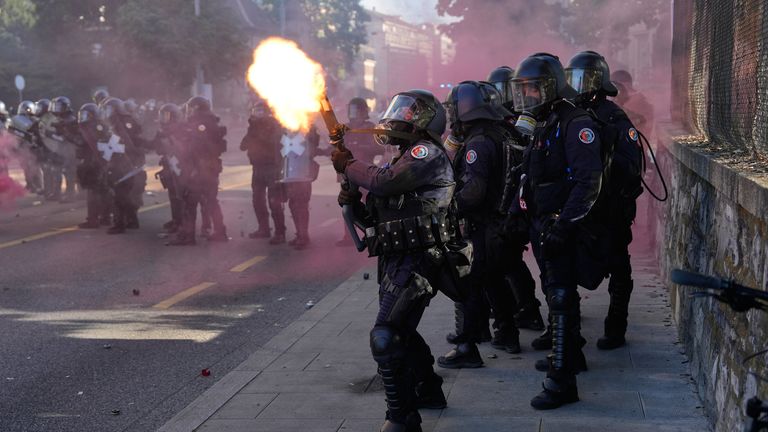 Police fire a tear gas canister during a 'No G7' demonstration in Geneva, Switzerland, ahead of the G7 summit. Pic: AP