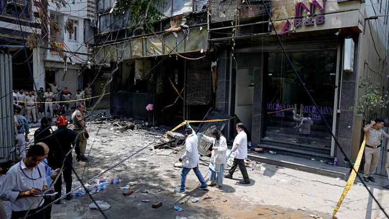 A medical team arrives on the scene. Pics: AP