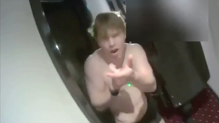 Natland points imaginary gun at police. Pic: Met Police 