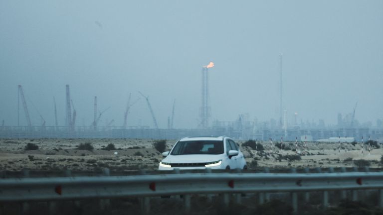 A car passes Ras Laffan Industrial City. Pic: Reuters/Stringer