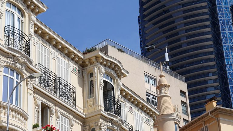 A drone flies near the residential building as the investigation continues. Pic: Reuters