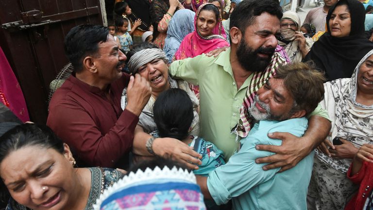 Relatives of the children killed or injured after the roof collapse. Pic: Reuters