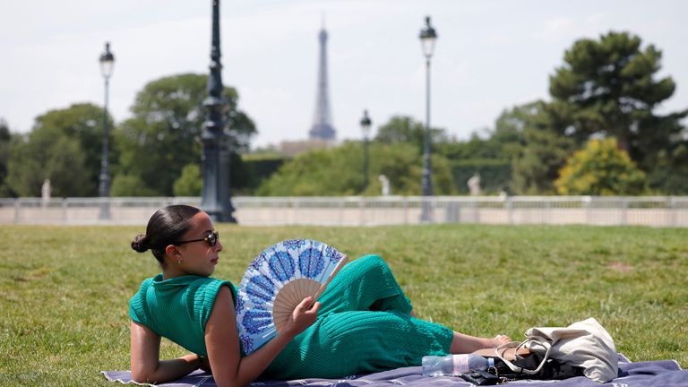 A woman sunbathes in the Tuileries Garden in Paris. Pic: Reuters