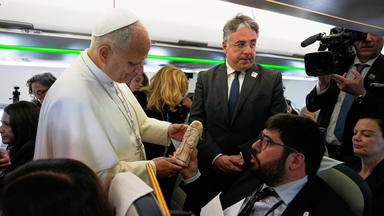 Pope Leo XIV was presented with a stat of the patron saint of Spain. Pic: AP