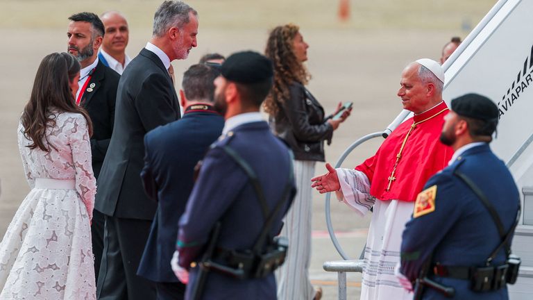 Spain’s King Felipe and Queen Letizia welcome Pope Leo XIV upon his arrival in Madrid. Pic: Reuters