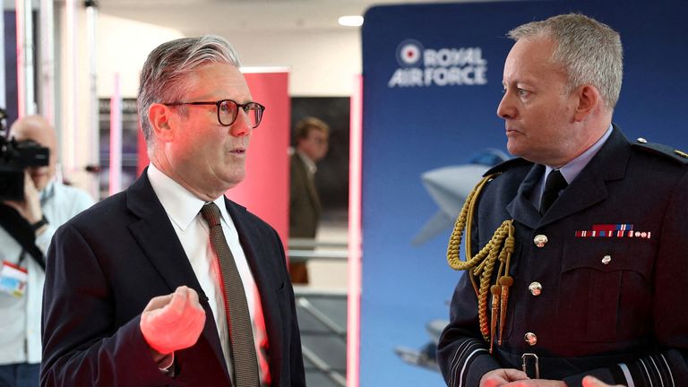 Sir Richard speaking to the prime minister at a defence contractor in Bedfordshire last year. Pic: Reuters