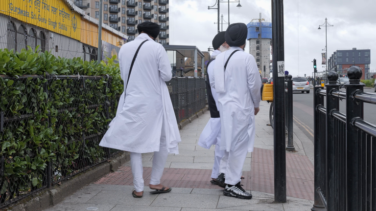 Members of the Sikh community leave a gurdwara in Southall, west London