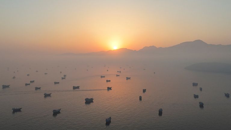 A drone view shows vessels in the Strait of Hormuz, as seen from Musandam, Oman, 15 June. Pic: Reuters