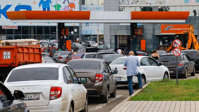 Cars queue to refuel at a petrol station in Russian-controlled Donetsk, Ukraine. Pic: Reuters