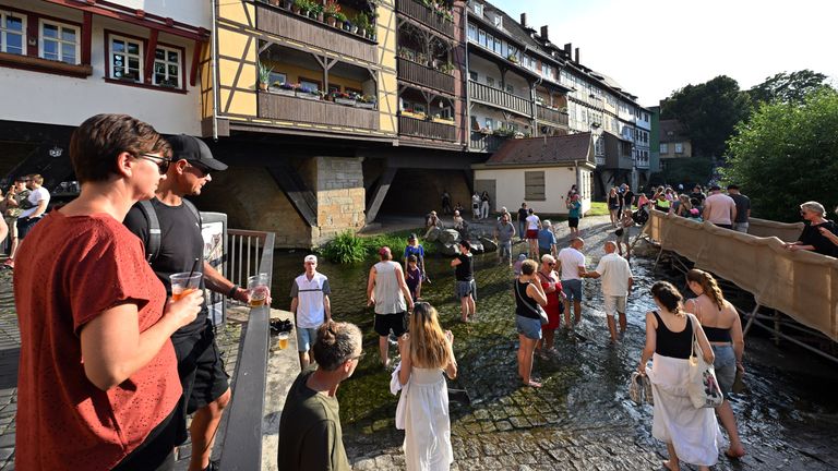 People enjoying the sun in the city of Erfurt, Germany. Pic: AP