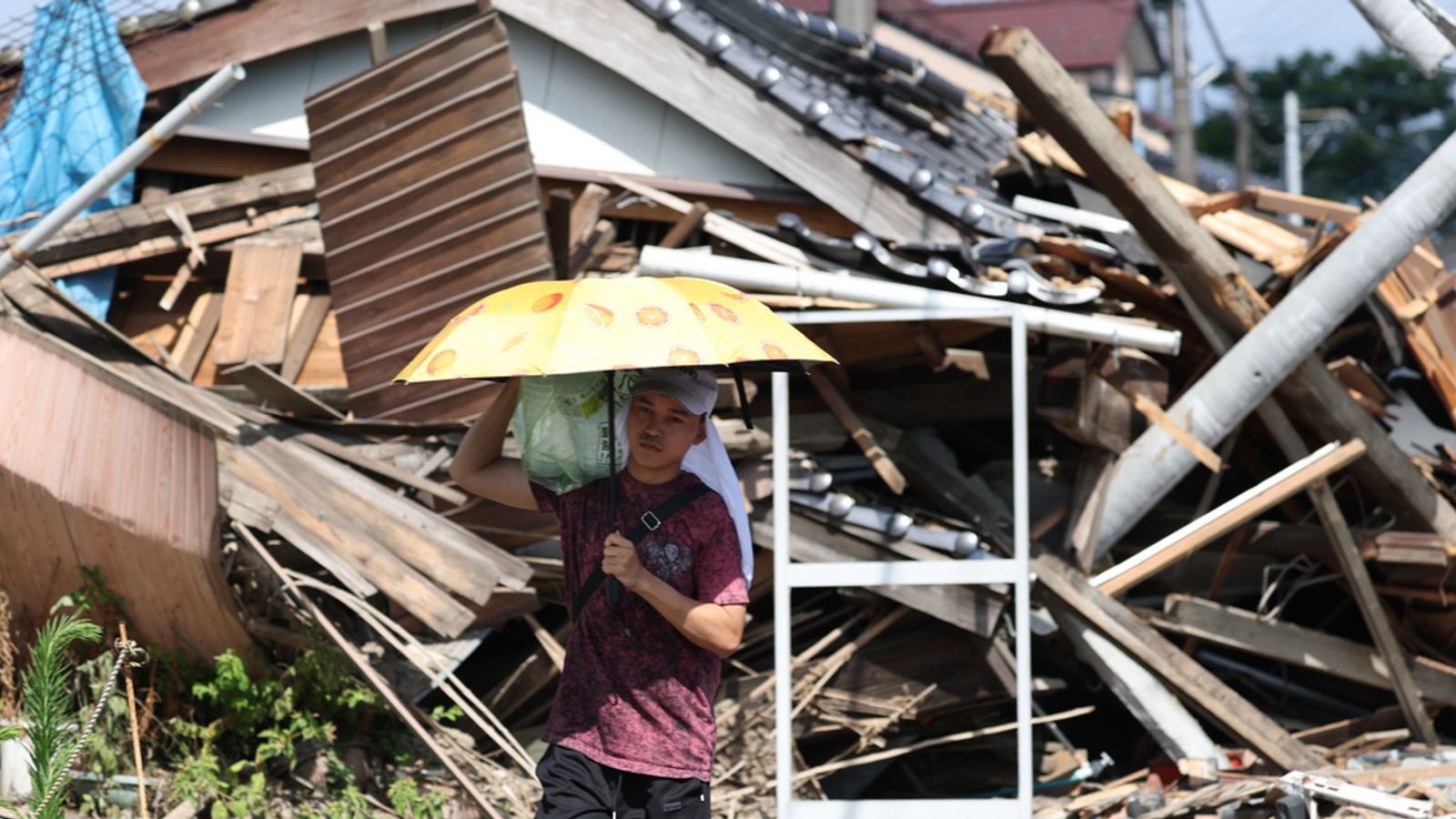 The death toll from Japan's powerful earthquake rises to 34; 9,000 people remain in shelters in searing heat