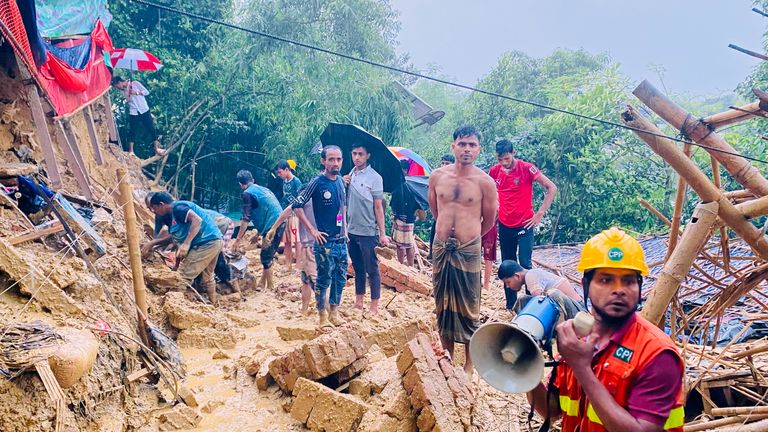 Rescuers search for more people feared buried at the camp in Cox's Bazar on Wednesday. Pic: AP
