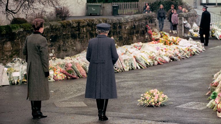 Princess Anne and Queen Elizabeth II laid a wreath outside the school gates just days after the tragedy. Pic: PA
