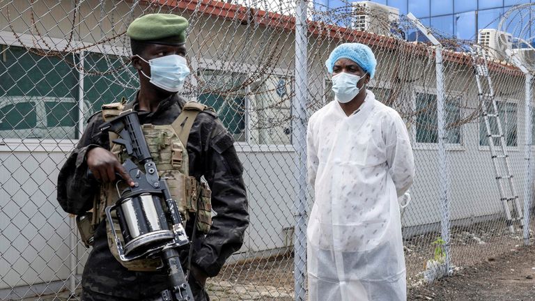 A member of the M23 rebel group guards a medical institute. Pic: Reuters