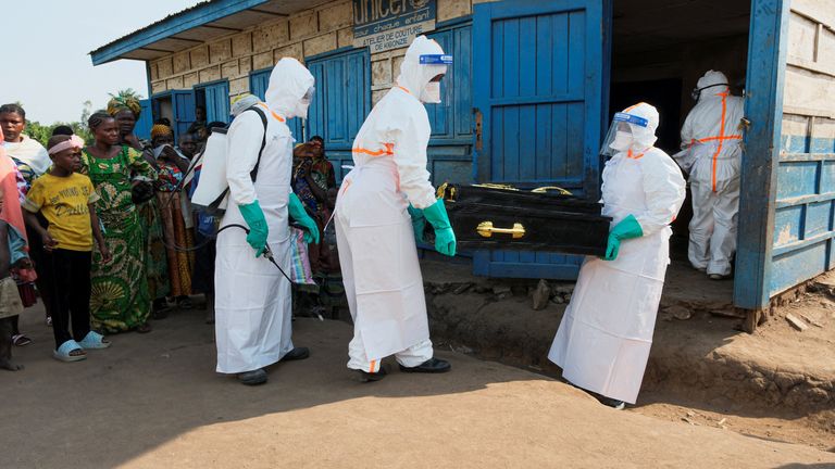 Workers carry the coffin of a child who is suspected to have died of Ebola at the Kigonze displaced persons camp. Pic: Reuters