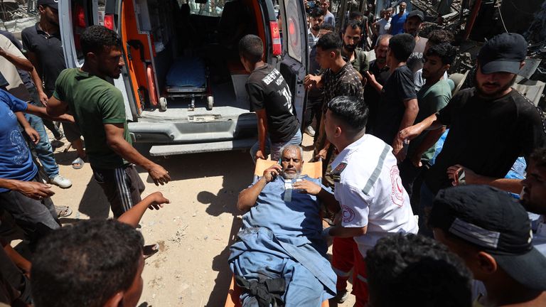 An injured Palestinian man following an Israeli strike on a metal foundry in Gaza City. Pic: Reuters 