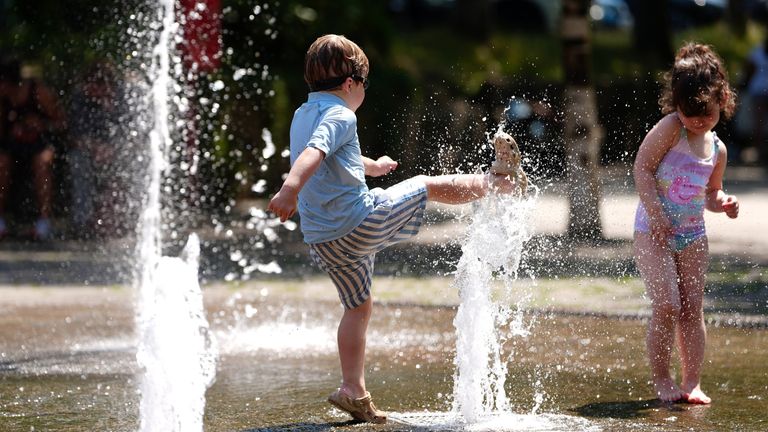 Children play in a fountain near the river Severn in Worcester. Pic: PA