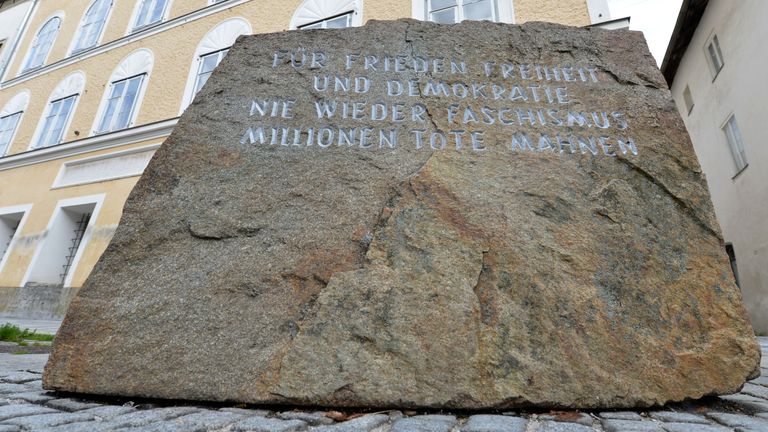 The memorial out the front saying "For peace, freedom and democracy. Never again fascism. Millions of dead people". Pic: AP