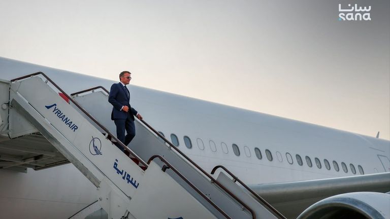 Mr Macron lands in Damascus. Pic: SANA
