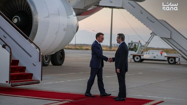 Mr Macron and Mr al-Shibani meet at the airport. Pic: SANA