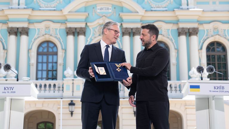 Starmer is presented with Ukraine's Order of Freedom. Pic: PA