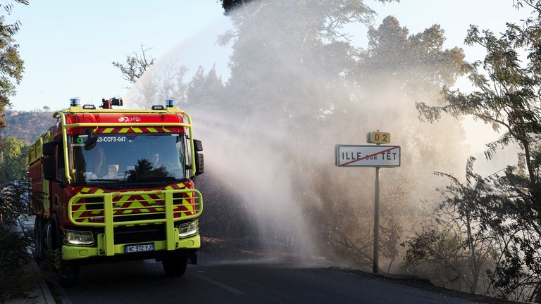 Firefighters work in the French Pyrenees, near the Spanish border. Pic: Reuters