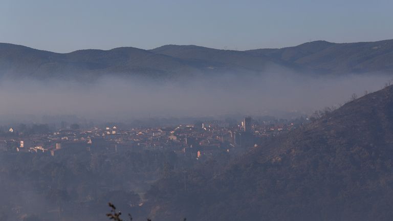 Smoke from approaching wildfires sweeps across Perpignan. Pic: Reuters