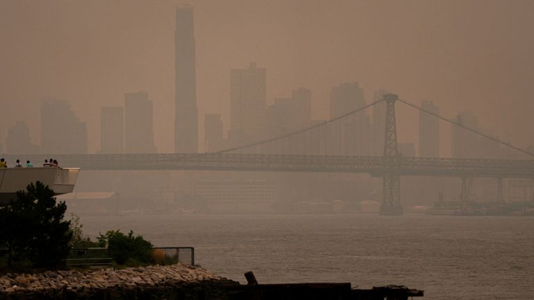 The New York City skyline is seen through a cover of wildfire smoke. Pic: Reuters
